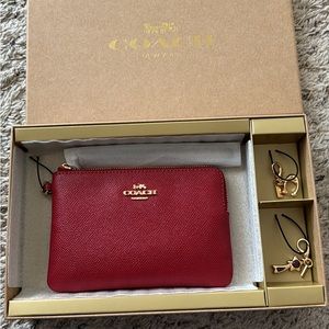 Coach wristlet with charms